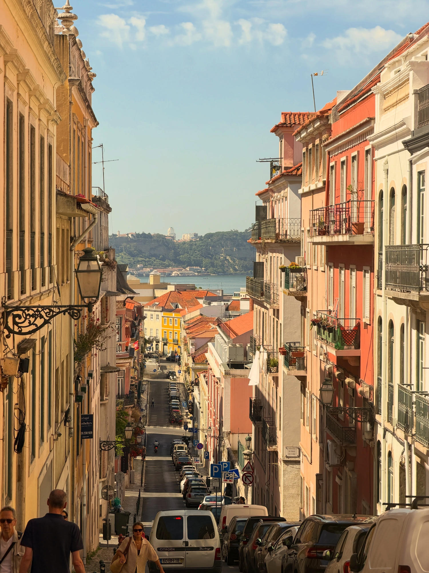 Steep Lisbon street looking down toward the Tagus river